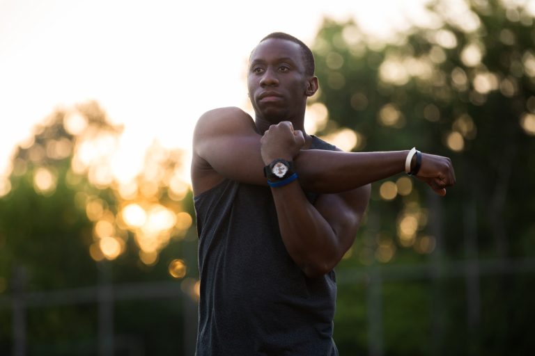 athlete stretching his upper body