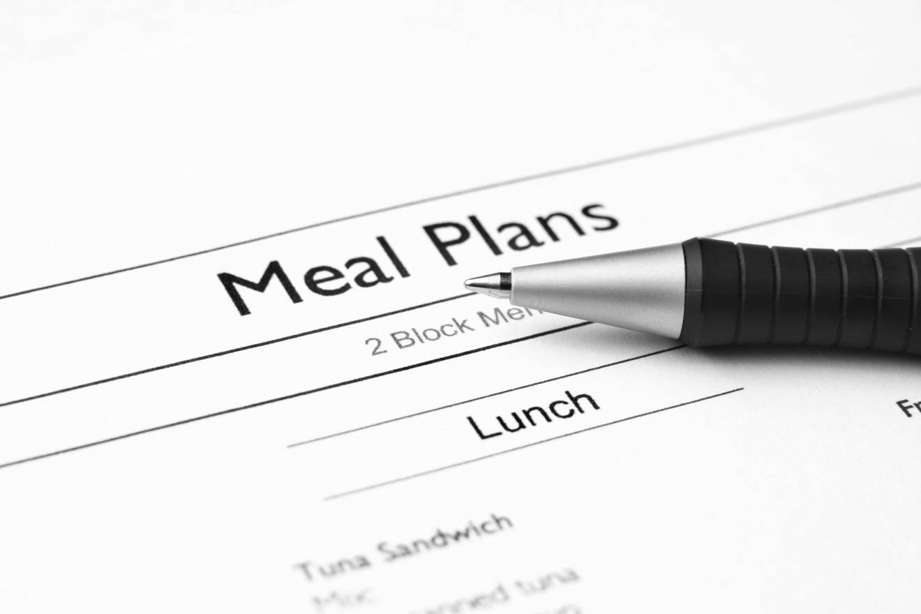 printed meal plan and pen