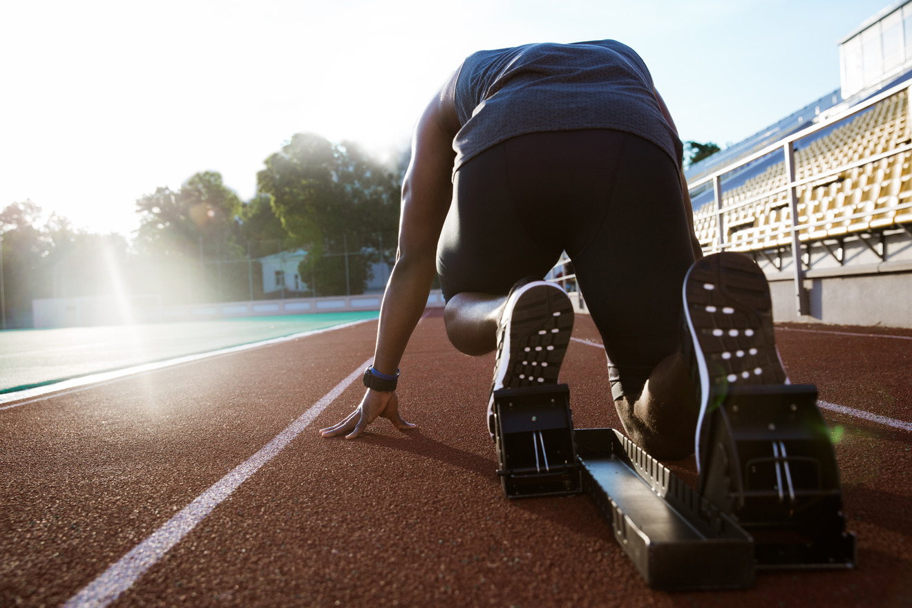 runner crouched on starting line