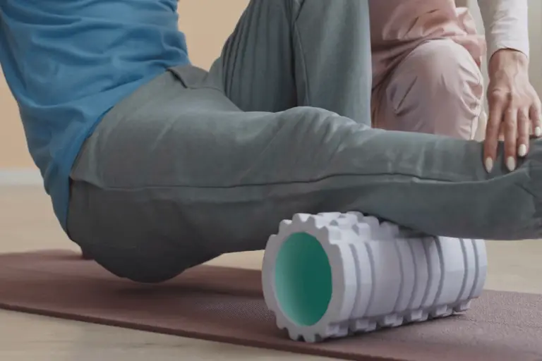 man foam rolling his leg