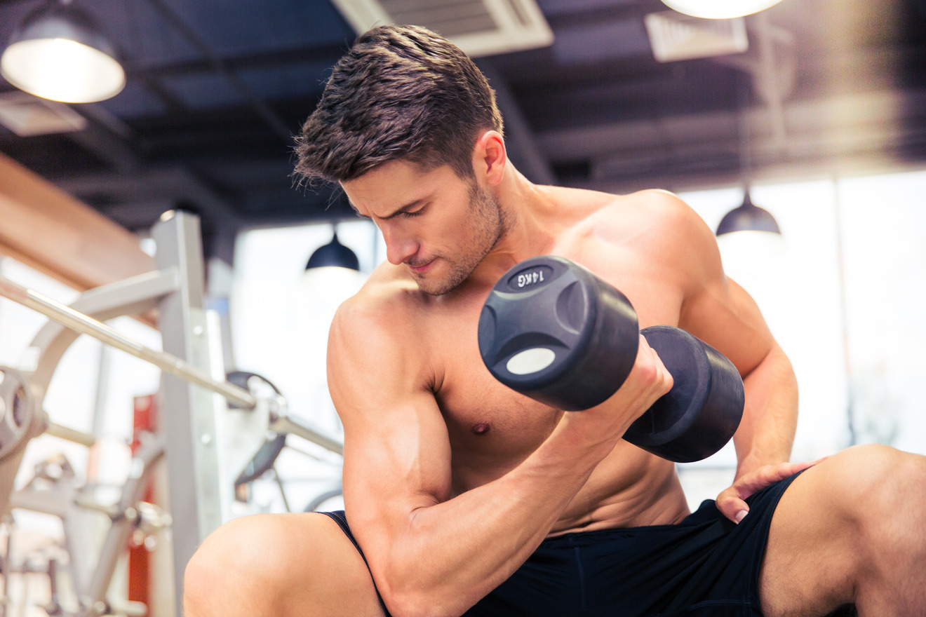 man performing a bicep curl on one arm