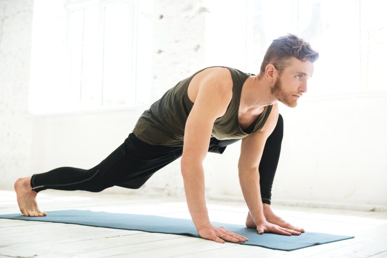 man working out at home with minimal equipment