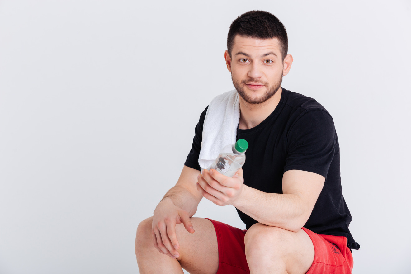 sports man holding a bottle of water