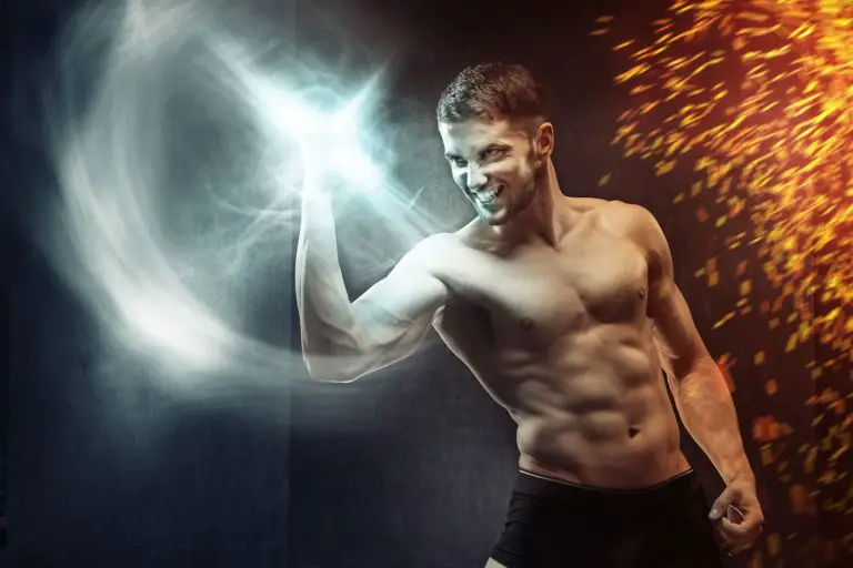 Inspirational shirtless man with glowing white fist and hot ambers behind him